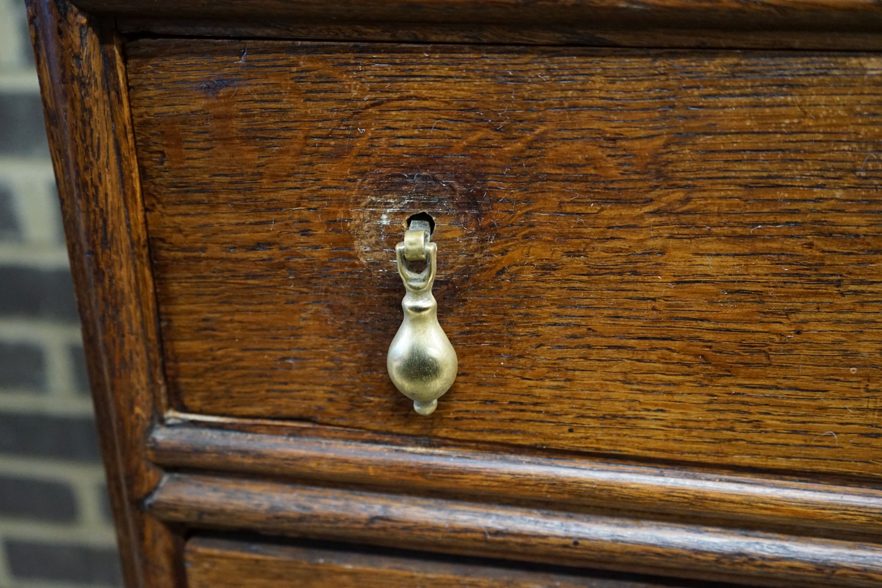 An 18th century oak chest on stand, width 104cm, depth 56cm, height 133cm